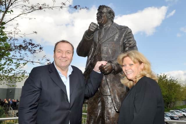 TRIBUTE: Kim and Duncan Revie stand next to the Don Revie statue at Elland Road. 
Picture: Gerard Binks.