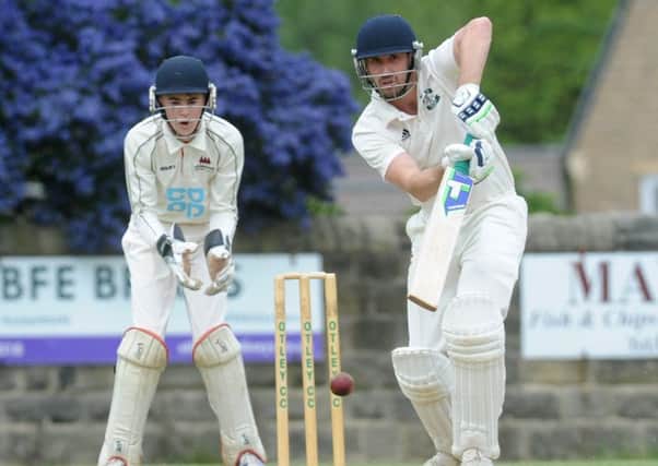 All-round star: James Davies reaches his 50 before going on to 126 and a five-wicket return for Aire-Wharfe leaders Otley against Addingham. Picture: Steve Riding
