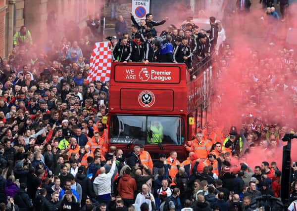 The Sheffield United players and manager Chris Wilder wave to the fans during the promotion parade in Sheffield City Centre. Pic: Danny Lawson/PA Wire.