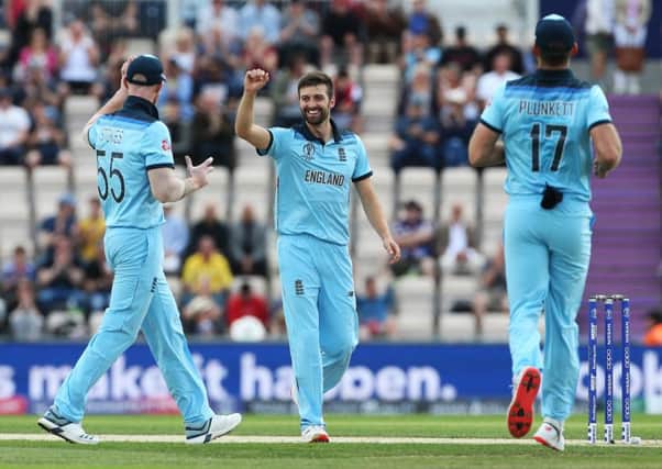 England's Mark Wood celebrates taking the wicket of Australia's Aaron Finch at The Hampshire Bowl. Picture: Mark Kerton/PA.