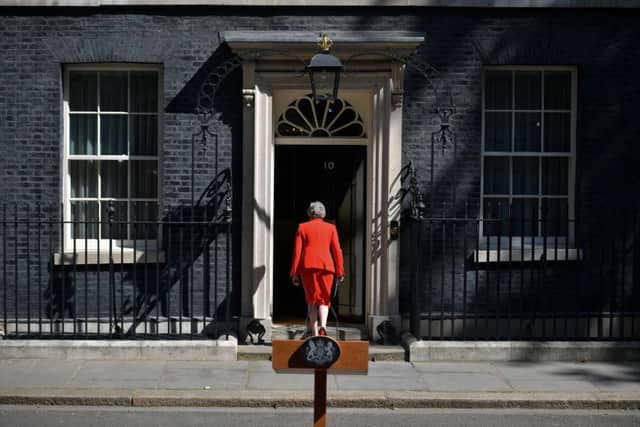 Theresa May walks back into 10 Downing Street after announcing her resignation. Who will replace her?