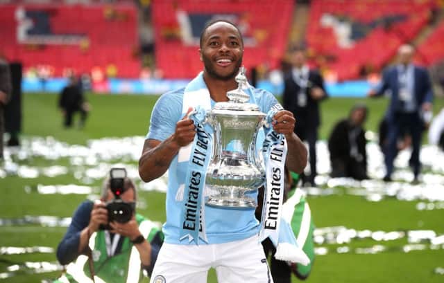 Manchester City's Raheem Sterling celebrates with the trophy after winning the FA Cup Final at Wembley Stadium, London. . Picture: Nick Potts/PA Wire.