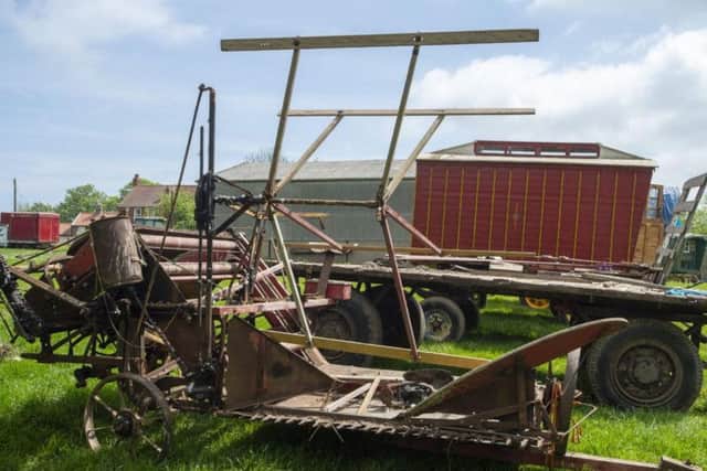 The collection contains antique farm machinery