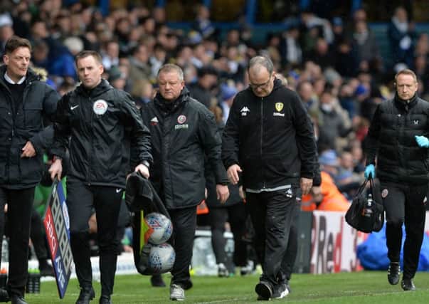 Chris Wilder and Marcelo Bielsa leave the pitch at half time during their Championship encounter at Elland Road in March.  Picture: Bruce Rollinson