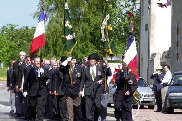 Veterans of the Green Howards taking part in the D Day commemorations of June 2004 on the 50th anniversary of the Normandy landings.