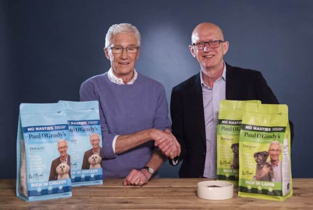 Paul O'Grady (left) is pictured with Steve Baker who is the MD of Burgess Pet Care.