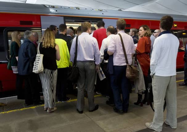Commuters waiting to board a train.