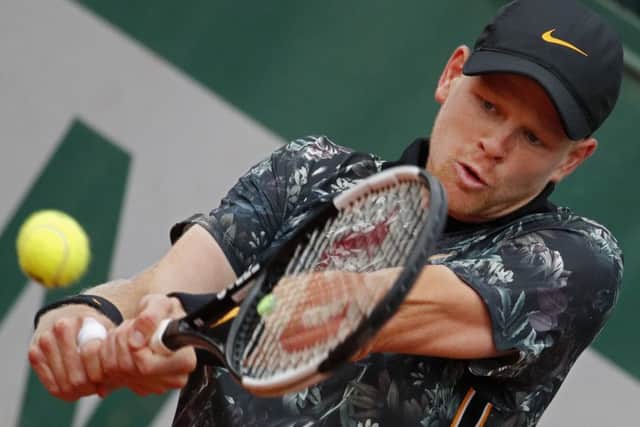 Out: Britain's Kyle Edmund in action against Uruguay's Pablo Cuevas before retiring through injury.