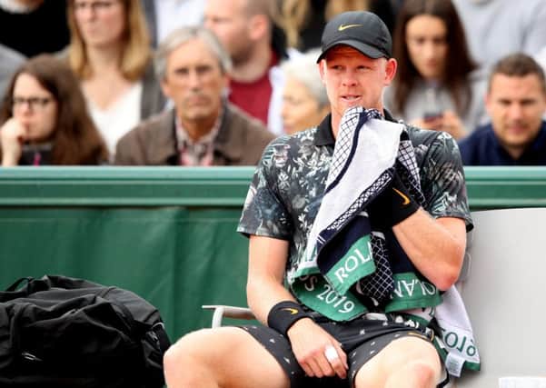 Retired: Kyle Edmund sits in his chair during a change of ends prior to calling the trainer and calling time on his involvement. (Picture: Adam Pretty/Getty Images)