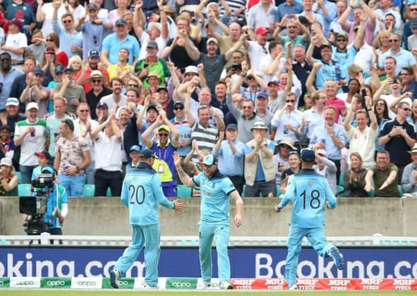England's Ben Stokes (centre) celebrates the catch of South Africa's Andile Phehlukwayo with team-mates.
