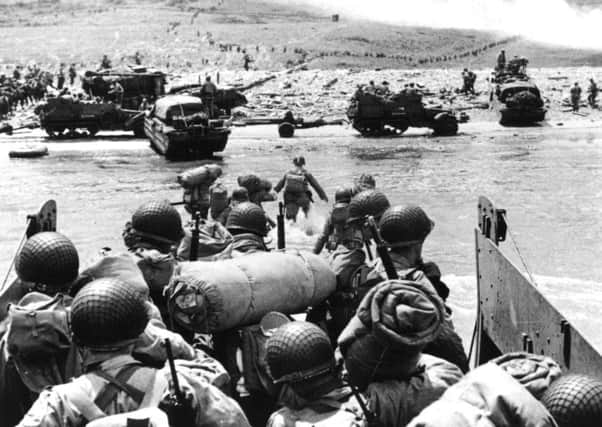 Thousands of troops landed on Normandy beaches on D-Day, June 6, 1944. (Photo by Fox Photos/Getty Images)