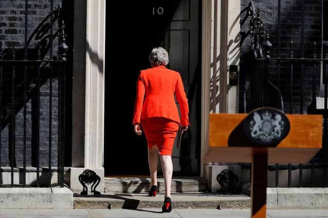 TOPSHOT - Britain's Prime Minister Theresa May leaves after announcing her resignation outside 10 Downing street in central London on May 24, 2019. - Beleaguered British Prime Minister Theresa May announced on Friday that she will resign on June 7, 2019 following a Conservative Party mutiny over her remaining in power. (Photo by Tolga AKMEN / AFP)        (Photo credit should read TOLGA AKMEN/AFP/Getty Images)