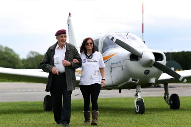 87-year-old former paratrooper Jeffrey Long, who is learning to fly, takes pub landlady Louise Johnson, who is petrified of flying for a spin from Sherburn Aero Club.