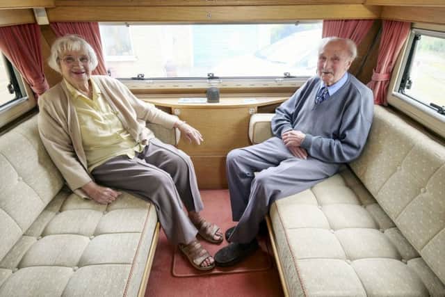 Jim with wife Rita in their caravan.