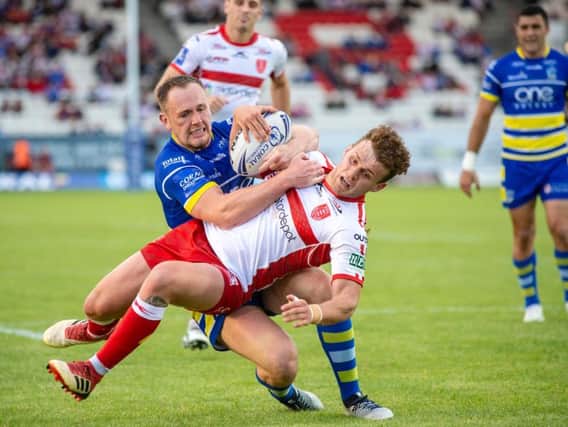 Warrington's Ben Currie produces a try-saving tackle on George Lawler (PIC:BRUCE ROLLINSON)