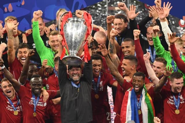 Winner at last: Liverpool manager Jurgen Klopp lifts the UEFA Champions League Trophy.