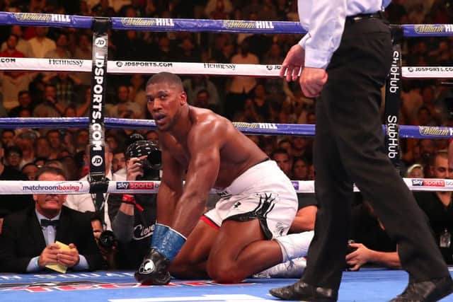 Down: Anthony Joshua is sent to the canvas.