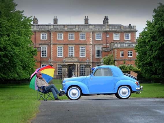 Michael Bray pictured with his 1955 Fiat Topolino outside Newby Hall.