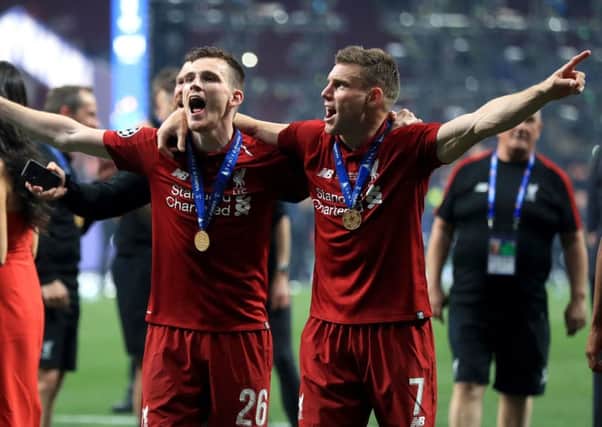 Liverpool's Andrew Robertson and James Milner celebrate victory in Madrid. Picture: Mike Egerton/PA
