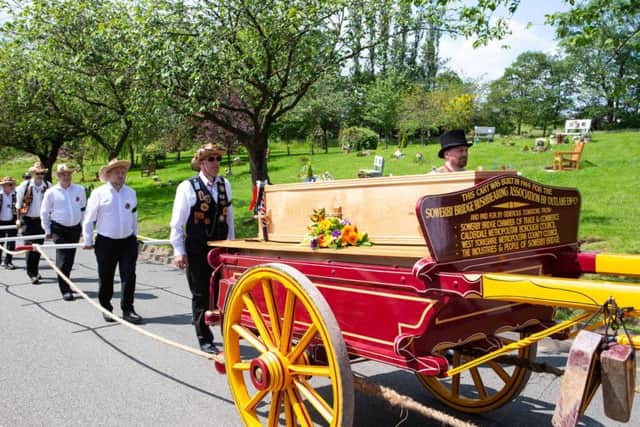 Funeral procession of Fred Knights, by rushbearing cart, for the co-founder and Honorary President of Sowerby Bridge Rushbearing Festival, to Park Wood Crematorium, Elland