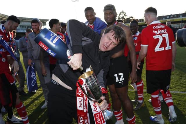 Barnsley's manager Daniel Stendel celebrates promotion after his team's match against Bristol Rovers at the Memorial Stadium. Picture: Darren Staples/PA