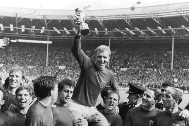 THE PINNACLE: Sir Geoff Hurst, fourth from left, celebrates with his England team-mates after winning the World Cup in 1966. Picture: Central Press/Getty Images)
