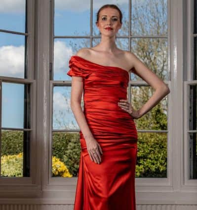 Bespoke flame orange goddess gown in stretch silk satin, guide price £900-£1300.

By Jillian Welch Design in Harrogate. Picture: Charlotte Graham

Pictures for the Great Yorkshire Show