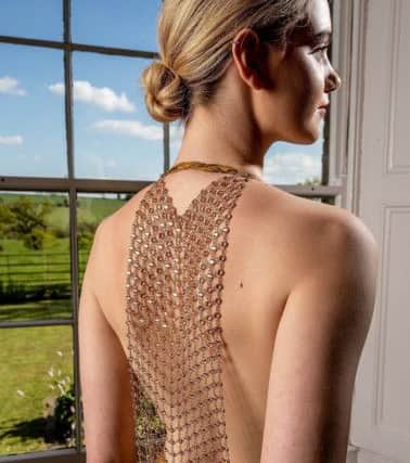 Bespoke full circle halterneck gown in rich Goldrod Dupionne silk with cowl back of Citrine jewelled mesh, guide price £700 plus back jewellery
. 

By Jillian Welch Design in Harrogate. Picture: Charlotte Graham

Pictures for the Great Yorkshire Show