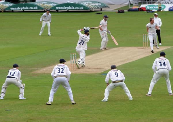 Driving force: Yorkshire's Stephen Petterson is driven by Essex's Tom Westley.