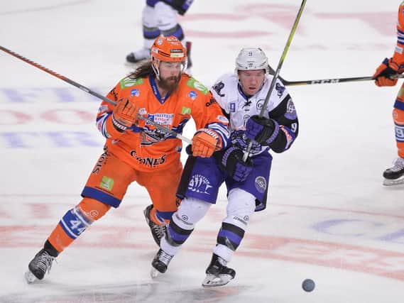 SWITCH OVER: Brendan Connolly battles with Steelers' Ryan Martinelli in Sheffield last season - the two being former team-mates at Belfast Giants the previous season. Picture: Dean Woolley.