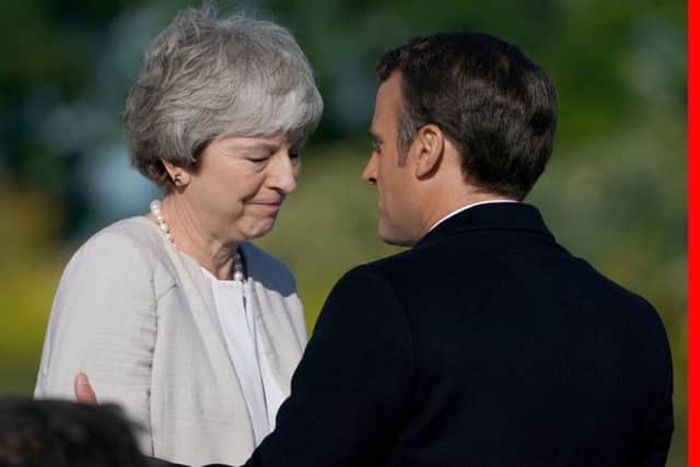 Theresa May with French president Emmanuel Macron at Thursday's D-Day commemmorations - she stepped down as Tory leader yesterday.