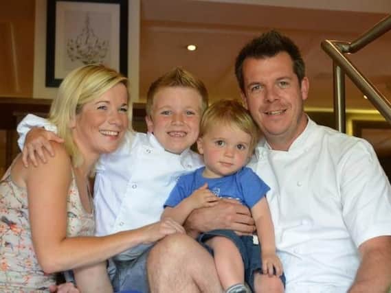 Happier times: Tim Bilton with wife Adele and sons Henry and Charlie