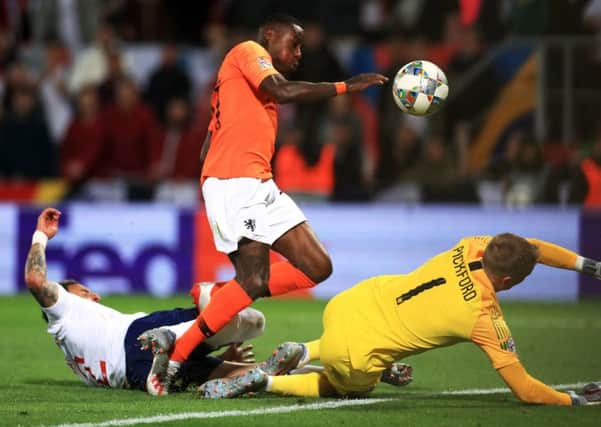 Netherlands' Quincy Promes shot deflects off England's Kyle Walker (left) resulting in an own goal during the Nations League Semi Final at Estadio D. Alfonso Henriques, Guimaraes. (Picture: Mike Egerton/PA Wire)