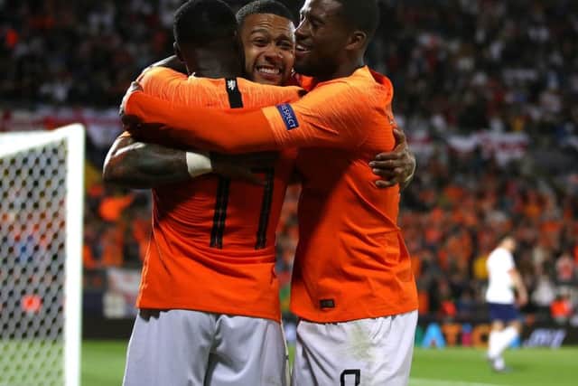 Netherlands' Memphis Depay (eft) celebrates scoring his side's third goal (Picture: Tim Goode/PA Wire)