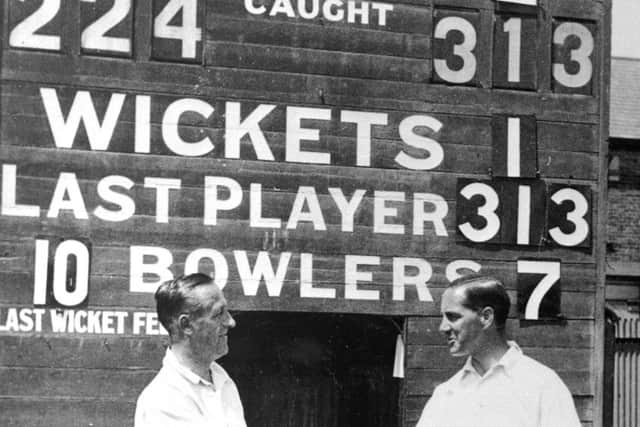 Scoreboard says it all: Percy Holmes and Herbert Sutcliffe  after their 555-run first-wicket stand v Essex at Leyton in 1932.