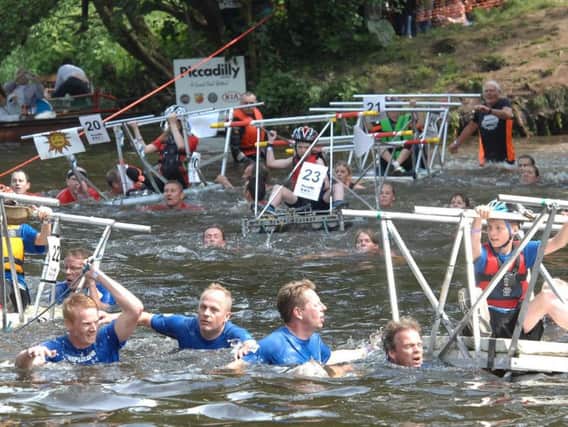 Bed Race teams cross the River Nidd