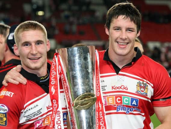 Joel Tomkins, right, with brother Sam after winning the 2010 Grand Final. (SWPix)