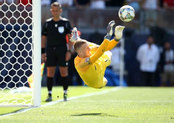 Jordan Pickford saves the decisive penalty from Switzerlands Josip Drmic to give England a 6-5 victory in the penalty shoot-out and third place in the inaugurual UEFA Nations League (Picture: Jan Kruger/Getty Images).