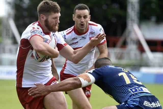 9
Ryan Shaw of Hull KR is tackled by Willie Isa of Wigan (Picture: Steve Riding)