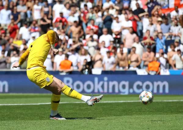 England goalkeeper Jordan Pickford scores a penalty during the shootout in Guimaraes. Picture: Tim Goode/PA