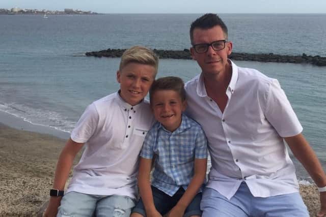 Making memories: Tim with his two sons Henry, 13 and Charlie seven.
