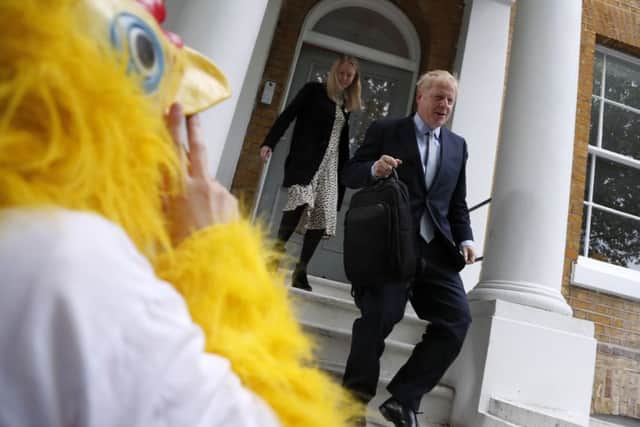 A person dressed as a chicken outside the home of Boros Johnson as the Tory leadership candidate continues to dodge questions.