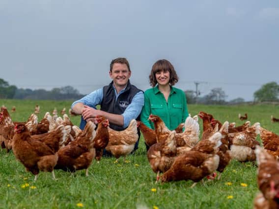 Ben and Emma with some of their 6,000 hens