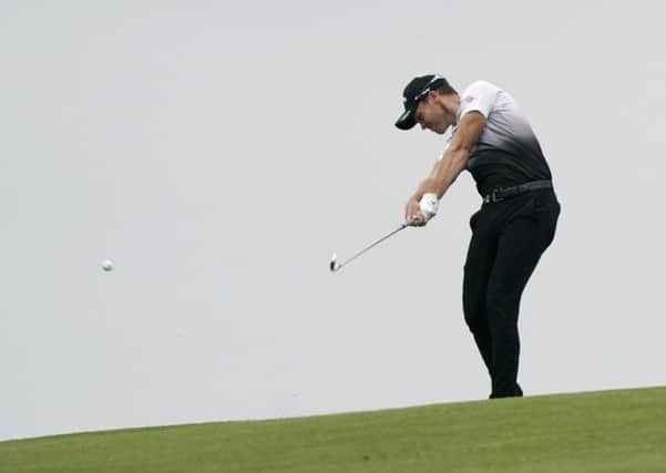 Danny Willett, of Sheffield, hits from the fairway on the ninth hole during the first round of the U.S. Open.  (AP Photo/David J. Phillip)