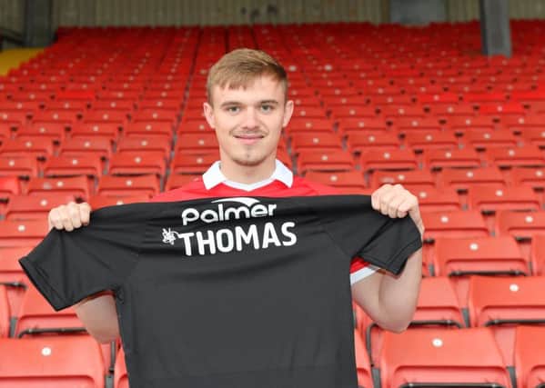 Stepping in: New Barnsley signing Luke Thomas.