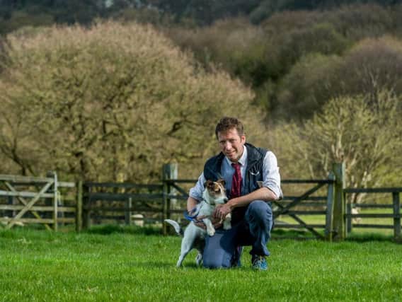Julian Norton, pictured with Emmy, his Jack Russell. Picture by James Hardisty.