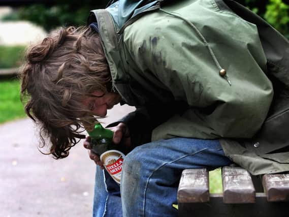 A street drinker (posed for by a model).