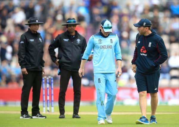 England's captain Eoin Morgan leaves the field injured during the World Cup group stage win over the West Indies at the Hampshire Bowl, Southampton (Picture: Adam Davy/PA Wire).