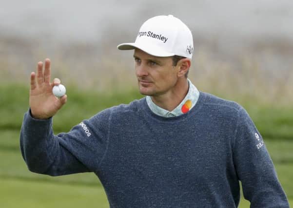 Lasting the pace: Justin Rose waves after his putt on the eighth.