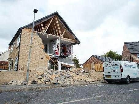 The house hit in the crash so was so badly damaged it is still being rebuilt.